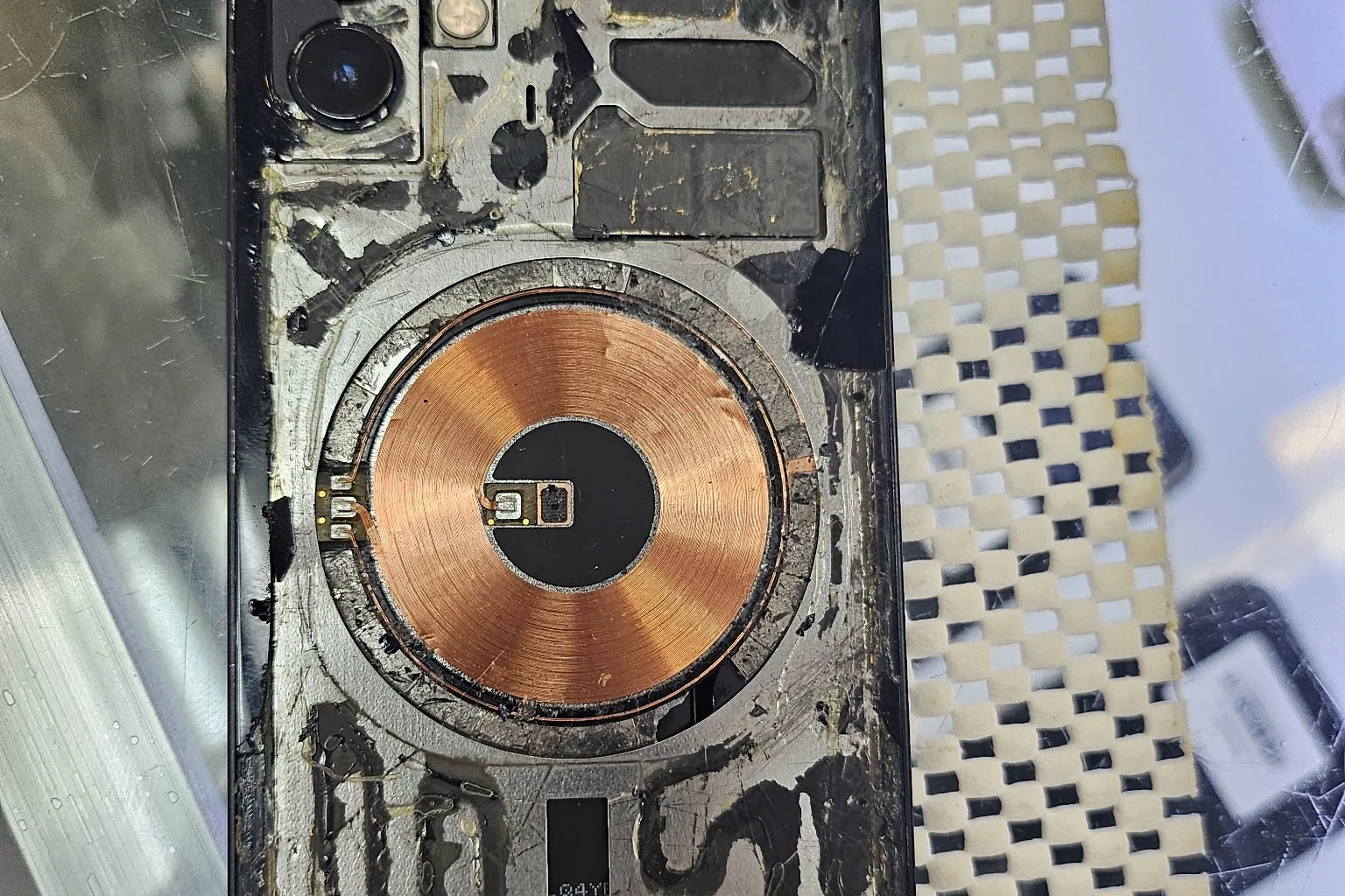 iPhone with shattered back glass before repair